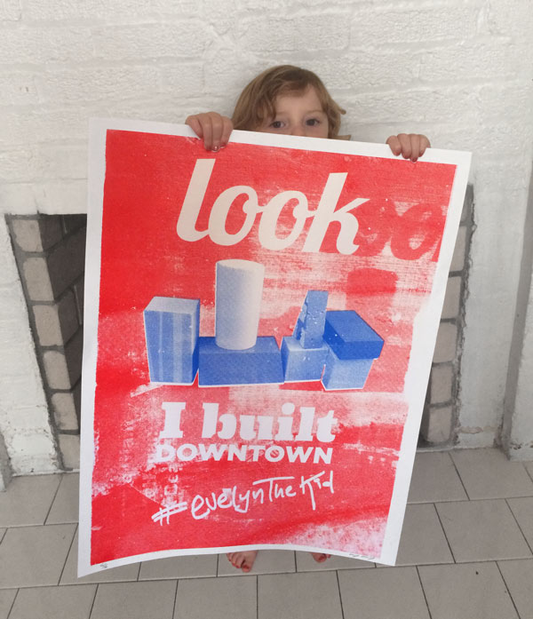 Evelyn Holding the print she collaborated on with Corey Kolb and George Cornwell